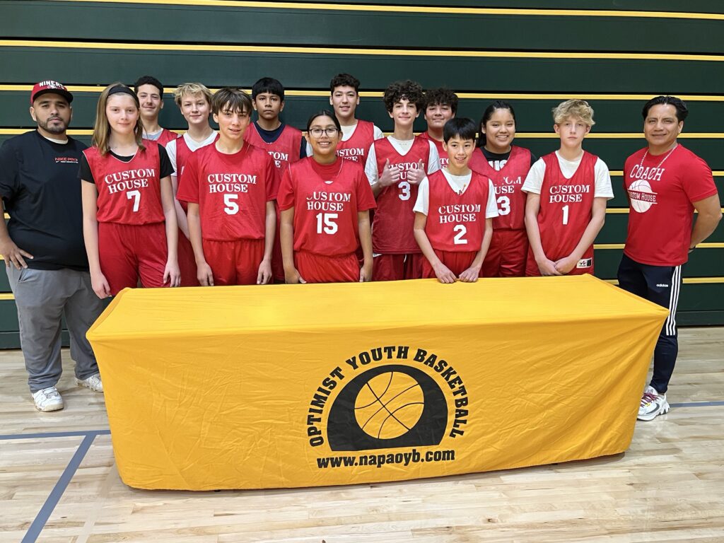 Youth basketball team group photo in red uniforms.